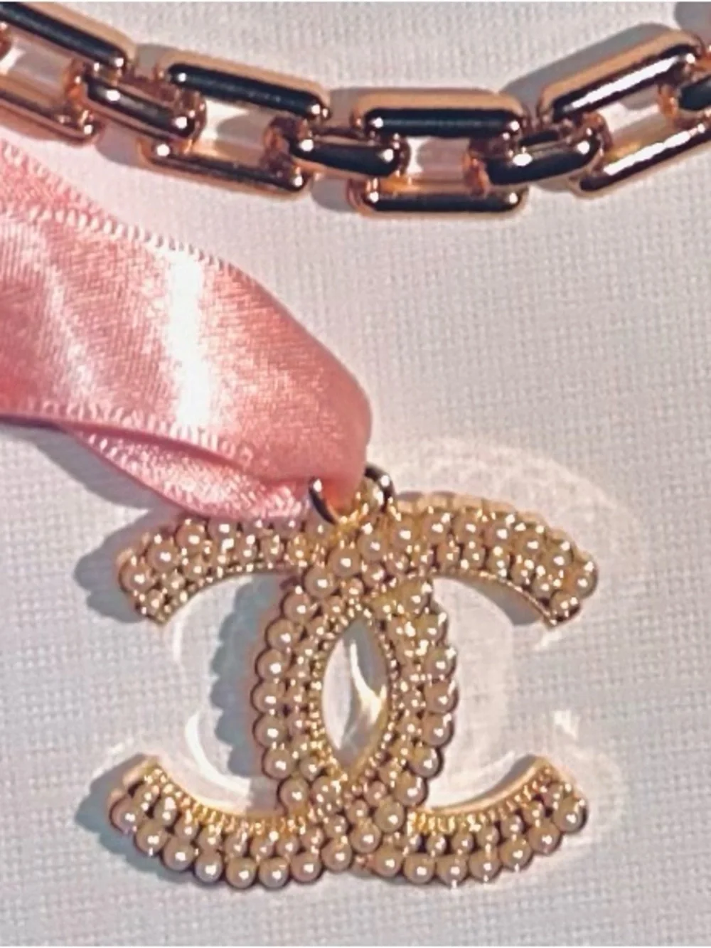 CHANEL Gold CC Pendant with Pink Ribbon New Elegant Chain